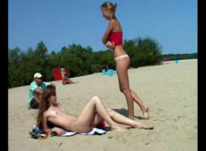 2 bare teens tempt an occasional boy on